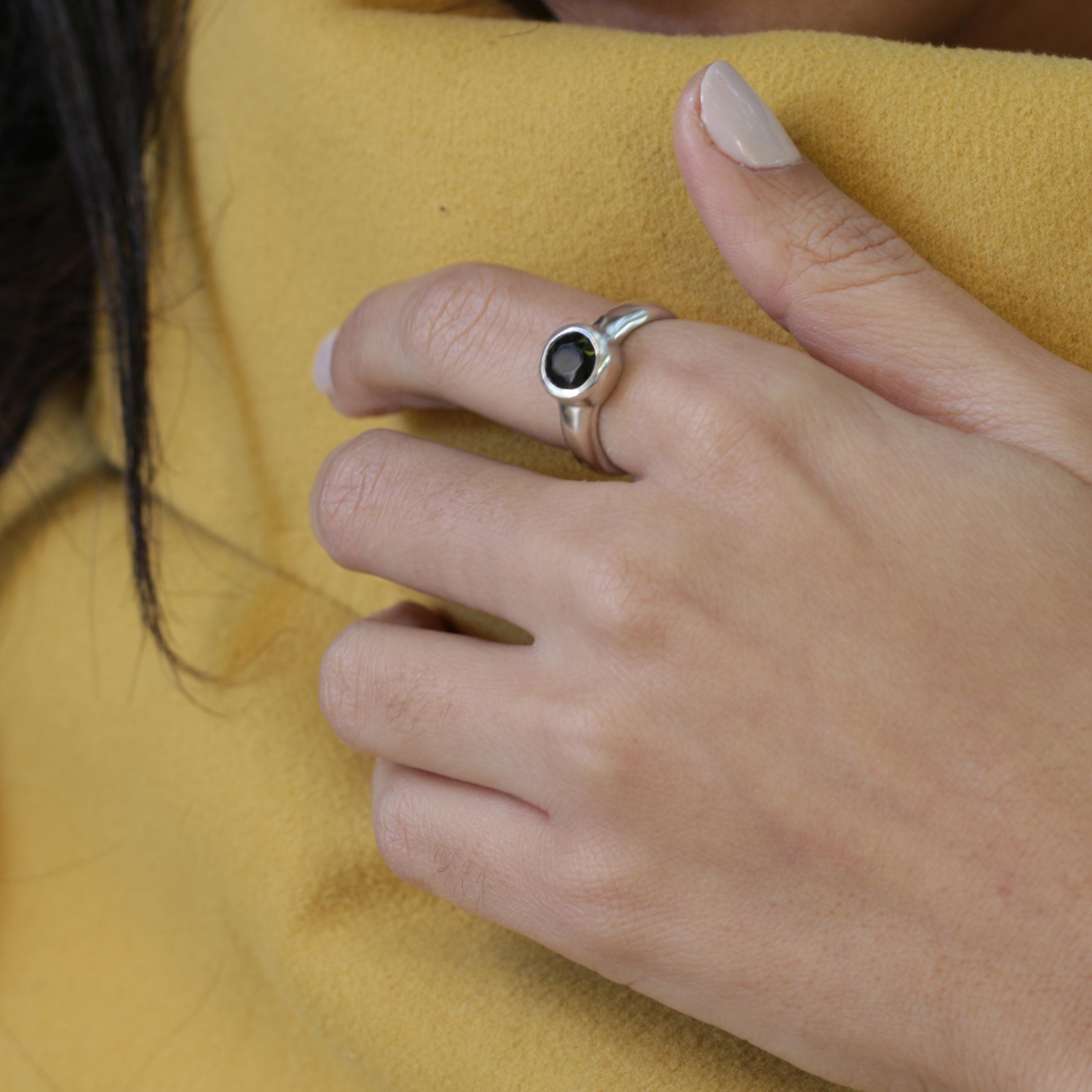 Handmade silver onyx ring in polished finish, reflecting artisanal craftsmanship and strength.