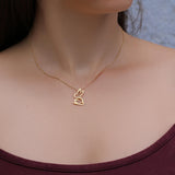 A gold chain necklace with a delicate outline of a rabbit pendant.
