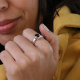 Faceted black onyx gemstone set in solid silver solitaire design, handmade and polished.