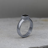 Bold handmade sterling silver statement ring featuring a black onyx gemstone.