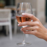 Gold geometric ring worn on a woman’s hand, capturing the minimalist modern look.