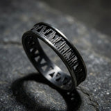 Close-up of the dark silver men’s ring highlighting the oxidized finish and geometric pattern.