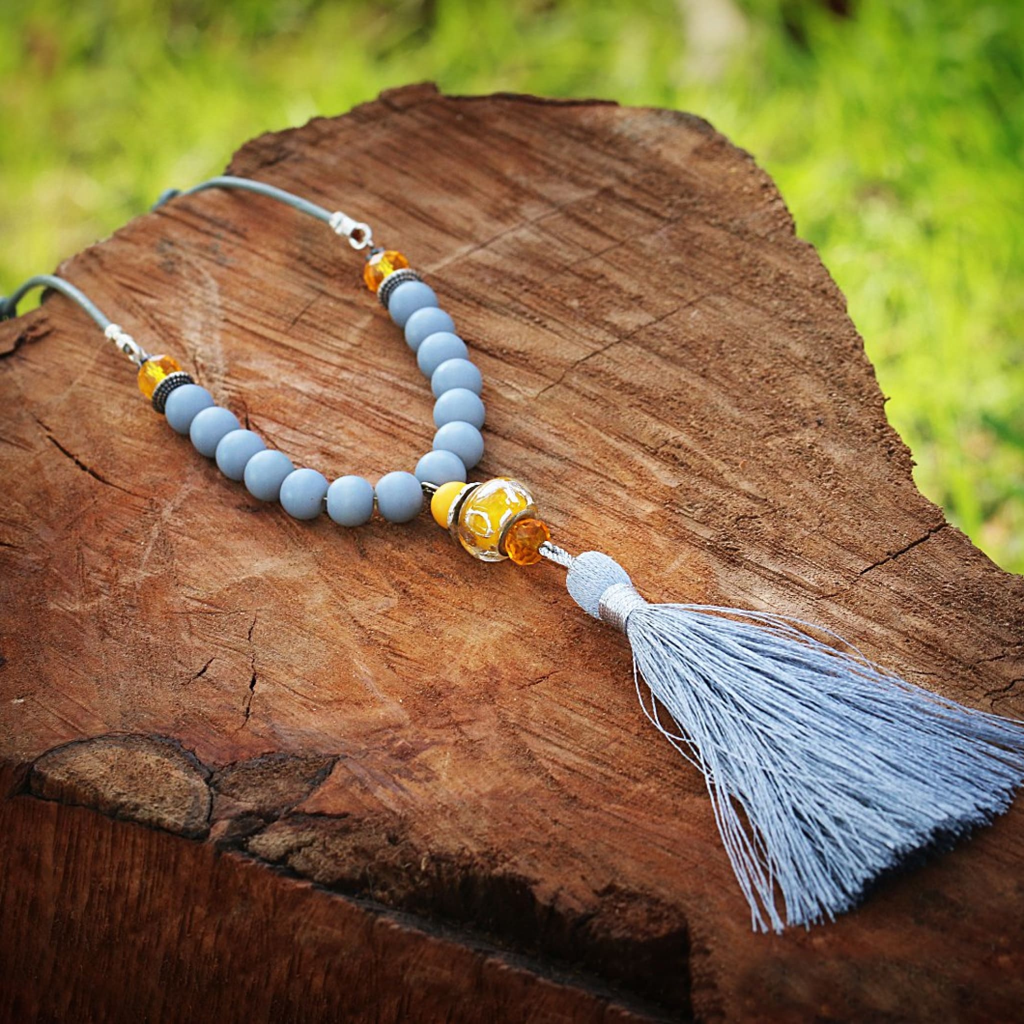 Hand Strung Beaded Necklace with Leather Tassel and Bullet – Carl &  Priscilla