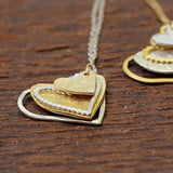 Intricate Long Silver Necklace With Heart Pendants Necklaces
